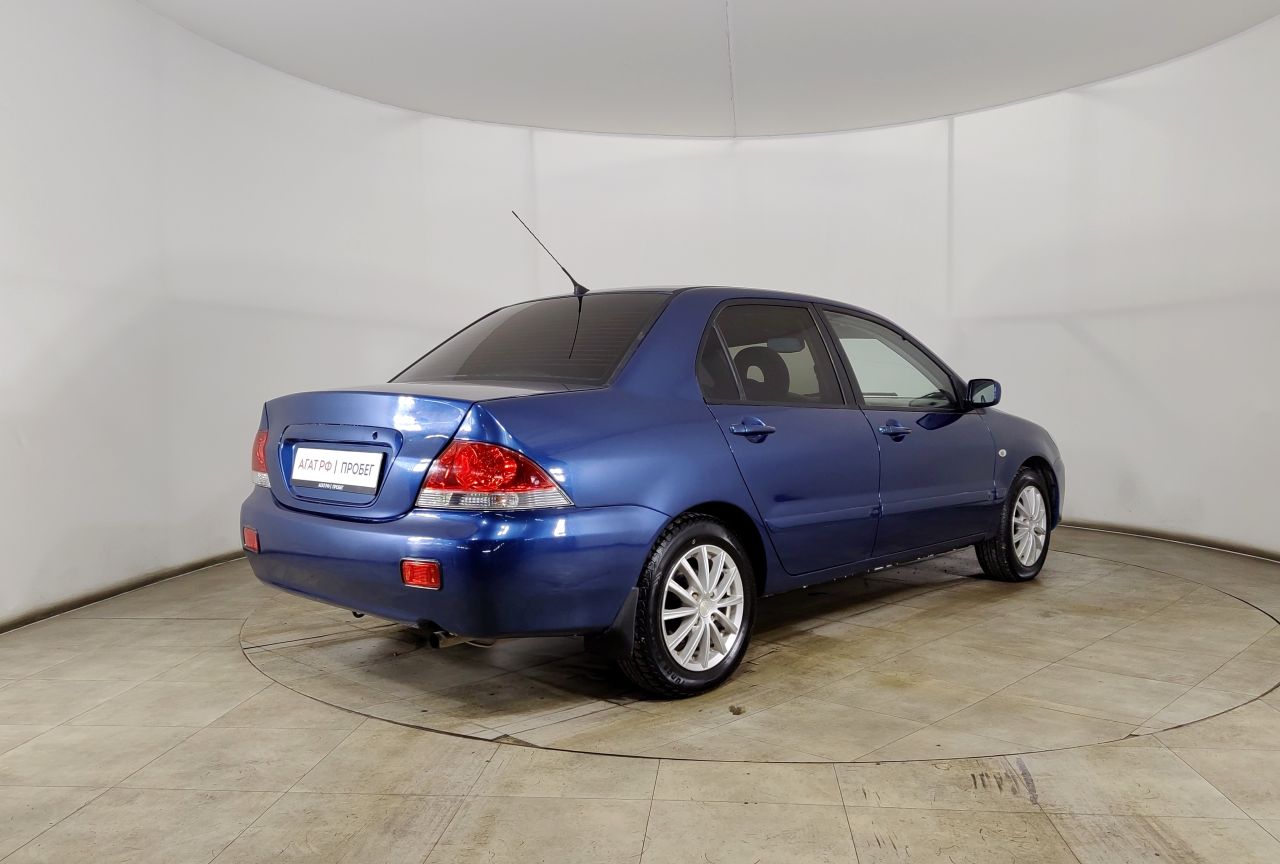 Mitsubishi Lancer — фото 5